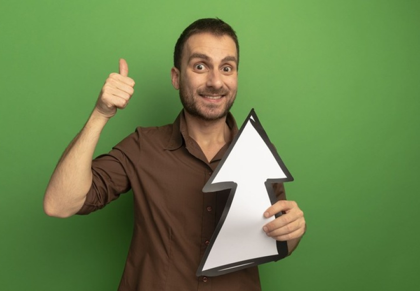 smiling-young-man-holding-arrow